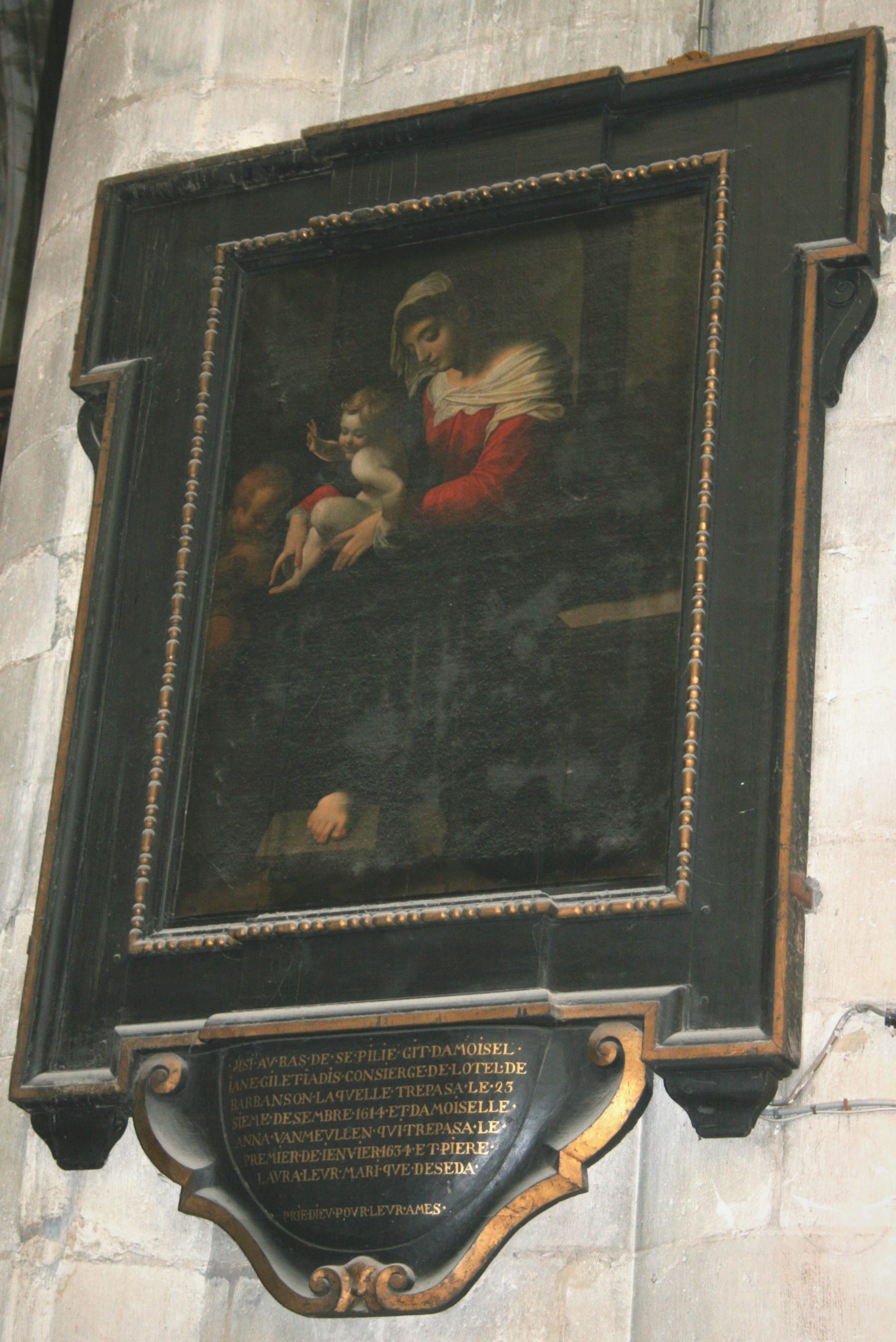 Peinture avant sa restauration représentant la Vierge à l’Enfant et Saint Jean Baptiste d’Abraham Janssen dans un cadre noir.